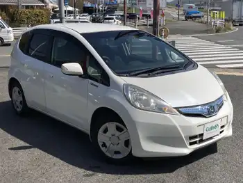 ホンダ フィット ハイブリット 10thアニバーサリー ワンオーナー・純HDDナビ・Bカメラ・HID