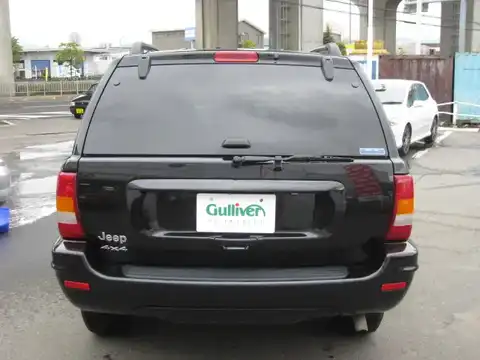 カタログ画像：ジープ・グランドチェロキー （JEEP GRAND CHEROKEE） リミテッド 2004年4月 GH-WJ40 4000cc ブリリアントブラッククリスタルパールコート 燃費6.5km / l バック