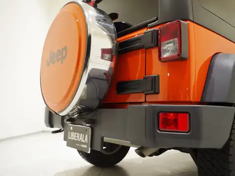 カタログ画像：ジープ・ラングラーアンリミテッド （JEEP WRANGLER UNLIMITED） サンセットオレンジ 2015年5月 ABA-JK36L 3600cc サンセットオレンジパールコート 燃費7.5km / l 外装