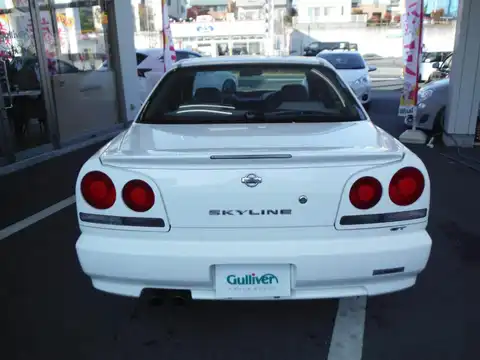 カタログ画像：スカイライン （SKYLINE） ＧＴスペシャルエディション 2000年8月 GF-HR34 2000cc ホワイト 燃費11.4km / l バック