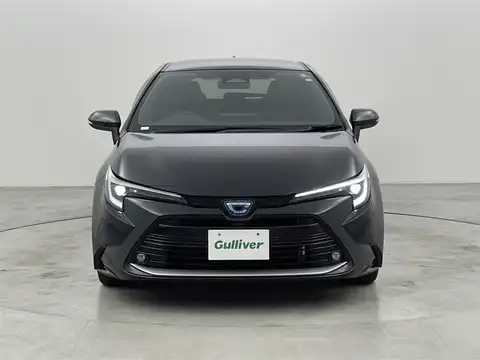 カタログ画像：カローラツーリング （COROLLA TOURING） ハイブリッド Ｘ 2024年4月 6AA-ZWE215W 1800cc アティチュードブラックマイカ 燃費27.8km / l フロント