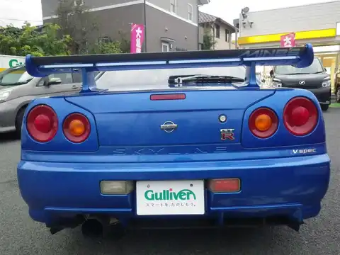 カタログ画像：スカイライン （SKYLINE） ＧＴ－Ｒ Ｖスペック 1999年1月 GF-BNR34 2600cc ベイサイドブルー（Ｍ）（カラークリアコーティング） 燃費8.1km / l バック