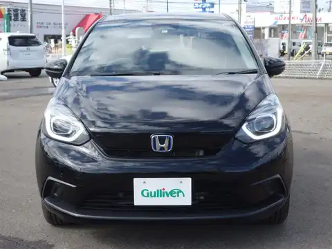 カタログ画像：フィット （FIT） ｅ：ＨＥＶベーシック 2021年6月 6AA-GR4 1500cc ミッドナイトブルービーム・メタリック 燃費25.6km / l フロント