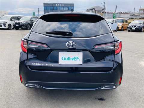 カタログ画像：カローラツーリング （COROLLA TOURING） ハイブリッド Ｇ 2024年4月 6AA-ZWE215W 1800cc アティチュードブラックマイカ 燃費27.5km / l バック