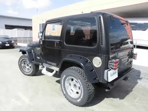 カタログ画像：ジープ・ラングラー （JEEP WRANGLER） スポーツ ハードトップ 1996年11月 E-TJ40H 4000cc ブラック 燃費6.4km / l バック