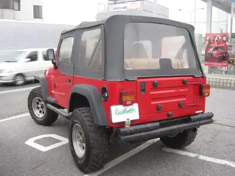 カタログ画像：ジープ・ラングラー （JEEP WRANGLER） スポーツ ソフトトップ 2000年1月 GF-TJ40S 4000cc フレームレッド 燃費6.2km / l バック