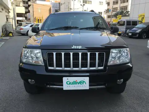 カタログ画像：ジープ・グランドチェロキー （JEEP GRAND CHEROKEE） リミテッドＶ８ 2004年4月 GH-WJ47 4700cc ブリリアントブラッククリスタルパールコート 燃費5.9km / l フロント