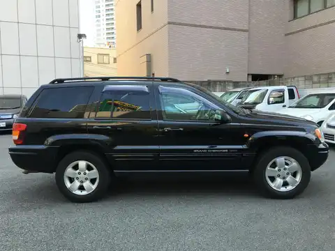 カタログ画像：ジープ・グランドチェロキー （JEEP GRAND CHEROKEE） リミテッドＶ８ 2004年4月 GH-WJ47 4700cc ブリリアントブラッククリスタルパールコート 燃費5.9km / l 外装