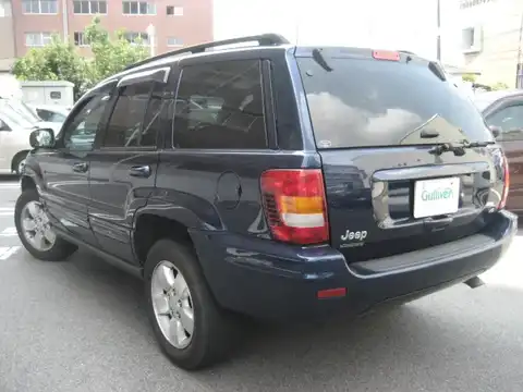 カタログ画像：ジープ・グランドチェロキー （JEEP GRAND CHEROKEE） リミテッドＶ８ 2004年4月 GH-WJ47 4700cc パトリオットブルーパールコート 燃費5.9km / l バック