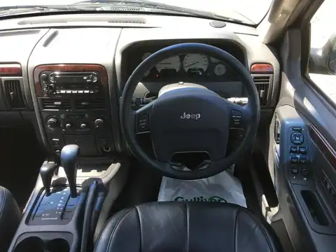 カタログ画像：ジープ・グランドチェロキー （JEEP GRAND CHEROKEE） リミテッド 2004年4月 GH-WJ40 4000cc パトリオットブルーパールコート 燃費6.5km / l 内装