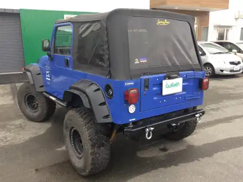 カタログ画像：ジープ・ラングラー （JEEP WRANGLER） スポーツ ソフトトップ 1999年1月 E-TJ40S 4000cc 燃費6.4km / l バック