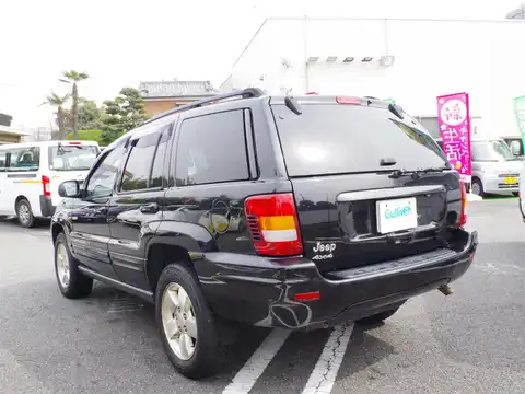 カタログ画像：ジープ・グランドチェロキー （JEEP GRAND CHEROKEE） ラレード 2003年6月 GH-WJ40 4000cc ブリリアントブラッククリスタルパールコート 燃費6.5km / l バック