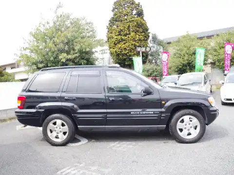 カタログ画像：ジープ・グランドチェロキー （JEEP GRAND CHEROKEE） ラレード 2003年6月 GH-WJ40 4000cc ブリリアントブラッククリスタルパールコート 燃費6.5km / l 外装