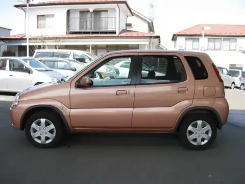 カタログ画像：スイフト （SWIFT） Ｌリミテッド 2003年12月 UA-HT51S 1300cc シャーベットオレンジメタリック 燃費18.0km / l 外装