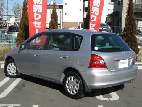 カタログ画像：シビック （CIVIC） 日本カー・オブ・ザ・イヤー／ＲＪＣカーオブザイヤー受賞記念特別仕様車 2001年2月 LA-EU1 1500cc サテンシルバー・メタリック 燃費19.4km / l バック