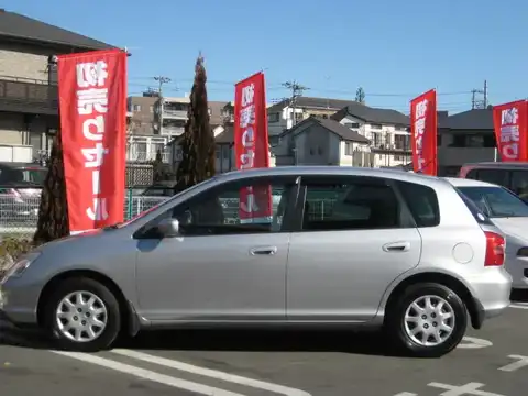 カタログ画像：シビック （CIVIC） 日本カー・オブ・ザ・イヤー／ＲＪＣカーオブザイヤー受賞記念特別仕様車 2001年2月 LA-EU1 1500cc サテンシルバー・メタリック 燃費19.4km / l 外装