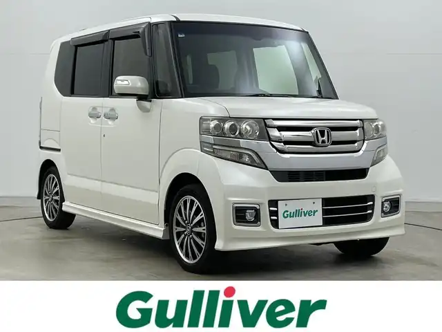 ホンダ Ｎ ＢＯＸ カスタム G ターボ Lパッケージ 岡山県 2016(平28)年 9.1万km プレミアムホワイトパールⅡ 純正ナビ（VXM-165VFi）/【フルセグ/BM/FM/USB】/両側パワースライドドア/クルーズコントロール/バックカメラ/ビルトインＥＴＣ/衝突軽減ブレーキ/オートライト/ＬＥＤヘッドライト/社外ドライブレコーダー(前後)/純正アルミホイール/パドルシフト/シートバックテーブル/ISOFIX