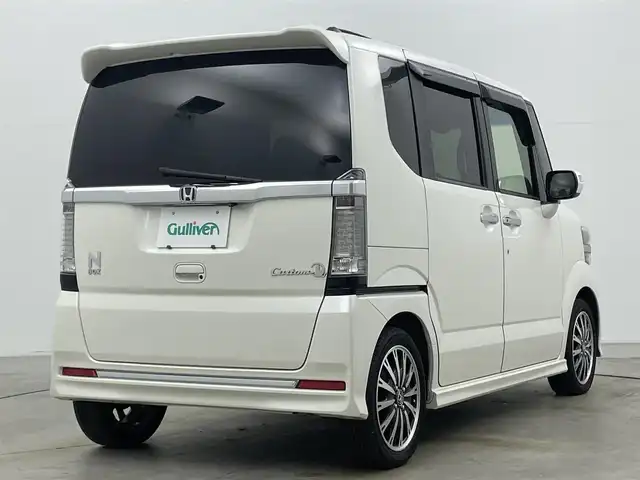 ホンダ Ｎ ＢＯＸ カスタム G ターボ Lパッケージ 岡山県 2016(平28)年 9.1万km プレミアムホワイトパールⅡ 純正ナビ（VXM-165VFi）/【フルセグ/BM/FM/USB】/両側パワースライドドア/クルーズコントロール/バックカメラ/ビルトインＥＴＣ/衝突軽減ブレーキ/オートライト/ＬＥＤヘッドライト/社外ドライブレコーダー(前後)/純正アルミホイール/パドルシフト/シートバックテーブル/ISOFIX