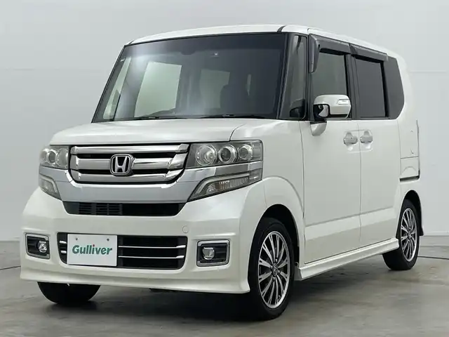 ホンダ Ｎ ＢＯＸ カスタム G ターボ Lパッケージ 岡山県 2016(平28)年 9.1万km プレミアムホワイトパールⅡ 純正ナビ（VXM-165VFi）/【フルセグ/BM/FM/USB】/両側パワースライドドア/クルーズコントロール/バックカメラ/ビルトインＥＴＣ/衝突軽減ブレーキ/オートライト/ＬＥＤヘッドライト/社外ドライブレコーダー(前後)/純正アルミホイール/パドルシフト/シートバックテーブル/ISOFIX