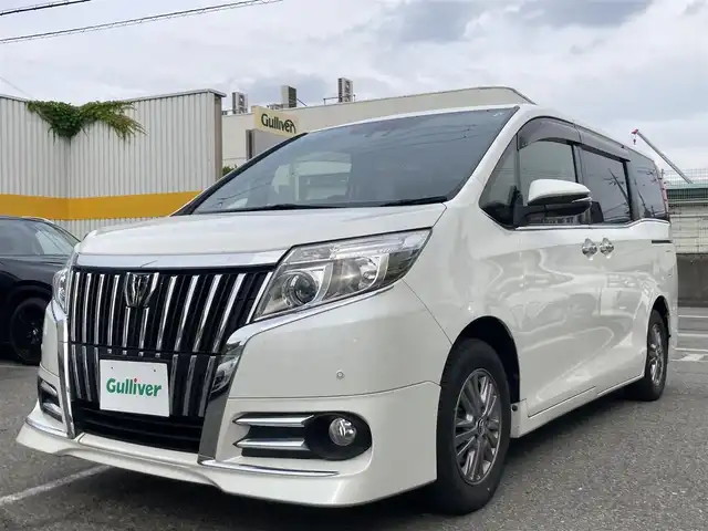 トヨタ エスクァイア Gi 兵庫県 2016(平28)年 7.9万km ホワイトパールクリスタルシャイン 純正SDナビ/フルセグTV/Bluetooth/AM/FM/CD/DVD/両側電動スライドドア/ETC/衝突被害軽減ブレーキ/車線逸脱防止/クルーズコントロール/シートヒーター/コーナーセンサー/オートハイビーム/スマートキー/電動格納ミラー/純正フロアマット/スタッドレスタイヤ積み込み/革巻きステアリング