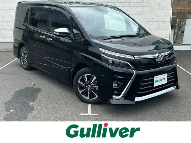 トヨタ ヴォクシー ZS 煌Ⅱ 静岡県 2020(令2)年 2.7万km ブラック 純正１０インチナビ　/・フルセグＴＶ　/・Ｂｌｕｅｔｏｏｔｈ接続　/・ＤＶＤ再生　/トヨタセーフティーセンス　/プリクラッシュセーフティ/レーンキープアシスト/横滑り防止装置/クルーズコントロール/両側パワースライドドア/バックカメラ/プッシュスタート　/スマートキー　/前後コーナーセンサー　/ドライブレコーダー/ビルトインＥＴＣ2.0/LEDオートライト/オートハイビーム/純正16インチアルミホイール