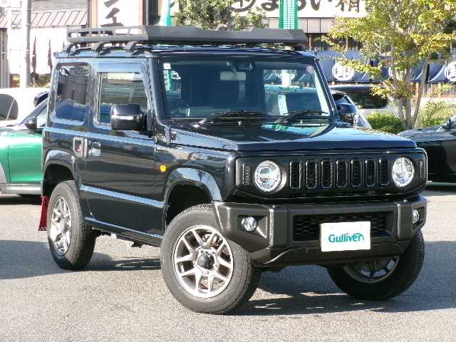 スズキ ジムニー XC 岡山県 2022(令4)年 4.5万km ブルーイッシュブラックパール3 【 SUZUKI Safety Support 】/・デュアルセンサーブレーキサポート/・誤発進抑制機能/・車線逸脱警報/・ふらつき警報/・先行車発進お知らせ機能/・標識認識機能/社外フロントグリル/リアラダー/ルーフキャリア/ディスプレイオーディオ/バックカメラ/Bluetooth/DVD再生可能/前席シートヒーター/クルーズコントロール/LEDヘッドライト/オートライト/ビルトインETC/社外フロアマット/純正16AW/スマートキー2個/取説・保証書