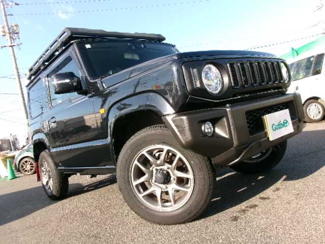 スズキ ジムニー XC 岡山県 2022(令4)年 4.5万km ブルーイッシュブラックパール3 【 SUZUKI Safety Support 】/・デュアルセンサーブレーキサポート/・誤発進抑制機能/・車線逸脱警報/・ふらつき警報/・先行車発進お知らせ機能/・標識認識機能/社外フロントグリル/リアラダー/ルーフキャリア/ディスプレイオーディオ/バックカメラ/Bluetooth/DVD再生可能/前席シートヒーター/クルーズコントロール/LEDヘッドライト/オートライト/ビルトインETC/社外フロアマット/純正16AW/スマートキー2個/取説・保証書