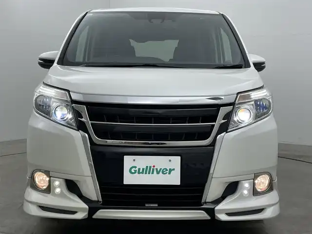 トヨタ エスクァイア Gi 岡山県 2016(平28)年 6.4万km ホワイトパールクリスタルシャイン 純正９インチナビ（NSZT-Y66T）/バックカメラ/純正１２．１インチ後席モニター/ＴＲＤエアロ（前/横/後下）/TRDフロントグリル/17インチＴＲＤホイール/ビルトインＥＴＣ２．０/ドライブレコーダー/両側電動スライドドア/クルーズコントロール/合皮シート/シートヒーター/衝突軽減ブレーキ/レーンキープアシスト/ＬＥＤヘッドライト/オートハイビーム/フォグランプ/スマートキー