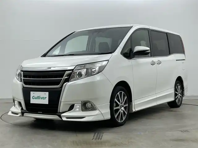 トヨタ エスクァイア Gi 岡山県 2016(平28)年 6.4万km ホワイトパールクリスタルシャイン 純正９インチナビ（NSZT-Y66T）/バックカメラ/純正１２．１インチ後席モニター/ＴＲＤエアロ（前/横/後下）/TRDフロントグリル/17インチＴＲＤホイール/ビルトインＥＴＣ２．０/ドライブレコーダー/両側電動スライドドア/クルーズコントロール/合皮シート/シートヒーター/衝突軽減ブレーキ/レーンキープアシスト/ＬＥＤヘッドライト/オートハイビーム/フォグランプ/スマートキー