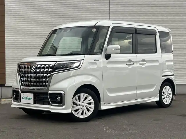 スズキ スペーシア カスタム HYBRID GS 秋田県 2023(令5)年 1.2万km ピュアホワイトP ４WD/衝突軽減システム/LEDヘッドライト/片側パワースライドドア/純正SDナビ（DVD/CD/BT）/フルセグ/スズキ純正アルミ（夏タイヤ装着）/スマートキー/アイドリングストップ/プッシュスタート/クルーズコントロール追従走行有/オートマチックハイビーム/コーナーセンサー/レーンキープアシスト/ステアリングスイッチ/前席シートヒーター/純正フロアマット/純正ドアバイザー/オートライト/オートエアコン/パワーステアリング/パワーウィンドウ/電動格納ウィンカーミラー/横滑り防止/盗難防止装置/寒冷地仕様/取扱説明書/スペアキー×１