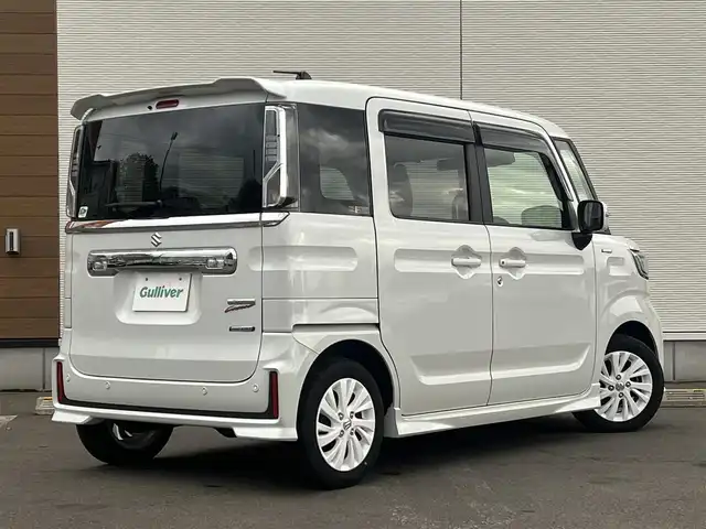 スズキ スペーシア カスタム HYBRID GS 秋田県 2023(令5)年 1.2万km ピュアホワイトP ４WD/衝突軽減システム/LEDヘッドライト/片側パワースライドドア/純正SDナビ（DVD/CD/BT）/フルセグ/スズキ純正アルミ（夏タイヤ装着）/スマートキー/アイドリングストップ/プッシュスタート/クルーズコントロール追従走行有/オートマチックハイビーム/コーナーセンサー/レーンキープアシスト/ステアリングスイッチ/前席シートヒーター/純正フロアマット/純正ドアバイザー/オートライト/オートエアコン/パワーステアリング/パワーウィンドウ/電動格納ウィンカーミラー/横滑り防止/盗難防止装置/寒冷地仕様/取扱説明書/スペアキー×１