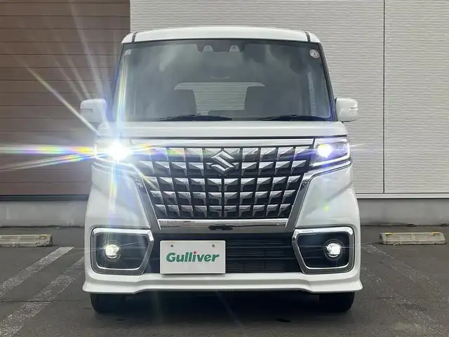 スズキ スペーシア カスタム HYBRID GS 秋田県 2023(令5)年 1.2万km ピュアホワイトP ４WD/衝突軽減システム/LEDヘッドライト/片側パワースライドドア/純正SDナビ（DVD/CD/BT）/フルセグ/スズキ純正アルミ（夏タイヤ装着）/スマートキー/アイドリングストップ/プッシュスタート/クルーズコントロール追従走行有/オートマチックハイビーム/コーナーセンサー/レーンキープアシスト/ステアリングスイッチ/前席シートヒーター/純正フロアマット/純正ドアバイザー/オートライト/オートエアコン/パワーステアリング/パワーウィンドウ/電動格納ウィンカーミラー/横滑り防止/盗難防止装置/寒冷地仕様/取扱説明書/スペアキー×１