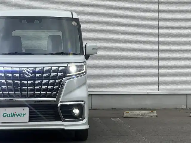 スズキ スペーシア カスタム HYBRID GS 秋田県 2023(令5)年 1.2万km ピュアホワイトP ４WD/衝突軽減システム/LEDヘッドライト/片側パワースライドドア/純正SDナビ（DVD/CD/BT）/フルセグ/スズキ純正アルミ（夏タイヤ装着）/スマートキー/アイドリングストップ/プッシュスタート/クルーズコントロール追従走行有/オートマチックハイビーム/コーナーセンサー/レーンキープアシスト/ステアリングスイッチ/前席シートヒーター/純正フロアマット/純正ドアバイザー/オートライト/オートエアコン/パワーステアリング/パワーウィンドウ/電動格納ウィンカーミラー/横滑り防止/盗難防止装置/寒冷地仕様/取扱説明書/スペアキー×１