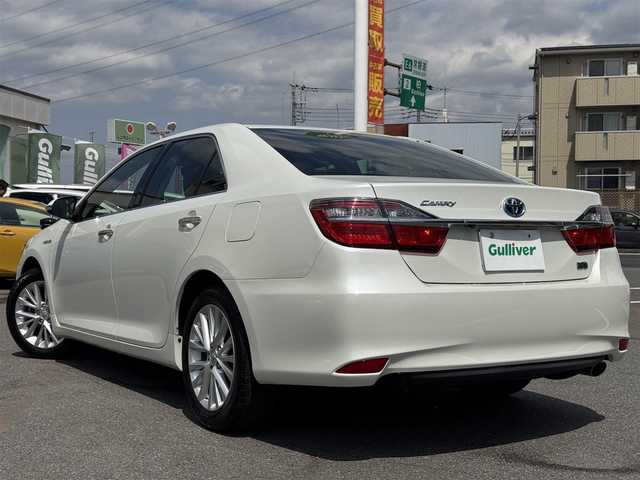 トヨタ カムリ ハイブリット レザーパッケージ 千葉県 2015(平27)年 2.8万km ホワイトパールクリスタルシャイン 純正メーカーナビ/フルセグTV/CD/DVD/SD/Bluetooth/バックカメラ/ビルトインETC/前ドラレコ/黒レザーシート/D/N席パワーシート/D/N席シートヒーター/置くだけ充電/革巻きステアリング/ウッドコンビステア/ステアリングリモコン/クルーズコントロール/HIDヘッドライト/フォグランプ/コーナーポール/プッシュスタート/純正フロアマット/新車時保証書/取扱説明書/スペアキー