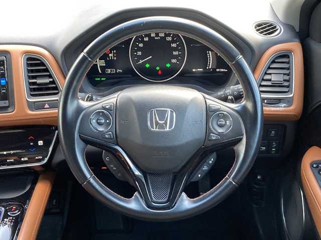 ホンダ ヴェゼル ハイブリッド Z ホンダセンシング 佐賀県 2016(平28)年 9.2万km ルーセブラックM ワンオーナー/Gathersナビ/バックカメラ/衝突被害軽減ブレーキ/路線逸脱警報/アダプティブクルーズコントロール/電動パーキングブレーキ/オートブレーキホールド/ステアリングリモコン/パドルシフト/ハーフレザーシート/シートヒーター/ドライブレコーダー/ビルトインＥＴＣ/プッシュスタート/スマートキー/LEDヘッドライト/フォグライト/純正アルミホイール