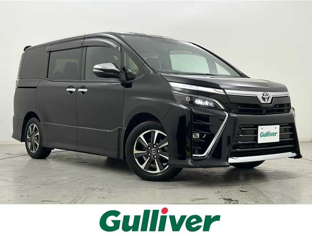トヨタ ヴォクシー ZS 煌Ⅲ 宮城県 2020(令2)年 6.7万km ブラック 禁煙車/純正12インチフリップダウン/トヨタセーフティセンス/・プリクラッシュセーフティ/・レーンディパーチャーアラート/・オートマチックハイビーム/・レーダークルーズコントロール/両側パワースライドドア/純正10インチナビ/・BT/SD/HDMI/CD/DVD/AM/FM/フルセグTV/バックカメラ/ビルトインETC/革巻きステアリング/ステアリングスイッチ/ハーフレザーシート/サンシェード/シートバックテーブル/LEDヘッドライト/LEDフォグランプ/純正16インチアルミホイール/純正フロアマット/純正ドアバイザー/横滑り防止装置/アイドリングストップ