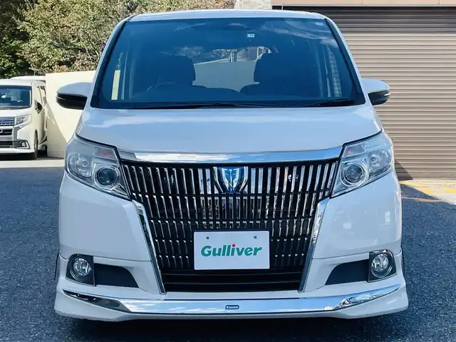 トヨタ エスクァイア ハイブリッド Gi 千葉県 2016(平28)年 6.9万km ホワイトパールクリスタルシャイン モデリスタエアロ/純正ナビ【フルセグ、BT、CD】/純正15インチアルミホイール/純正ドラレコ（前：DRT-H64A）/純正インテリアイルミネーション/純正フリップダウンモニター/純正フロアマット/社外15インチアルミ付冬タイヤ積込/ビルトインETC/クルーズコントロール/TRC/前席ヒーター/デュアルAC/置くだけ充電/オートライト/フォグ/ロック連動ミラー/バックカメラ/ドアバイザー/保証書