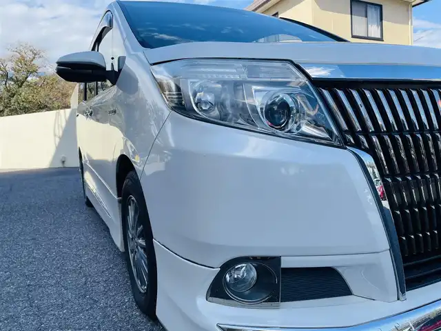 トヨタ エスクァイア ハイブリッド Gi 千葉県 2016(平28)年 6.9万km ホワイトパールクリスタルシャイン モデリスタエアロ/純正ナビ【フルセグ、BT、CD】/純正15インチアルミホイール/純正ドラレコ（前：DRT-H64A）/純正インテリアイルミネーション/純正フリップダウンモニター/純正フロアマット/社外15インチアルミ付冬タイヤ積込/ビルトインETC/クルーズコントロール/TRC/前席ヒーター/デュアルAC/置くだけ充電/オートライト/フォグ/ロック連動ミラー/バックカメラ/ドアバイザー/保証書