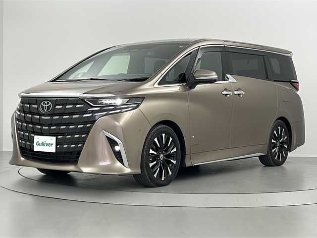 トヨタ アルファードハイブリット エグゼクティブ ラウンジ 福島県 2023(令5)年 1.1万km 茶 /禁煙車/／左右独立ツインムーンルーフ/／純正後席モニター/／トヨタチームメイト/・アドバンスドパーク//Toyota Safety Sense/・プリクラッシュセーフティ/・レーントレーシングアシスト/・レーダークルーズコントロール/・オートマチックハイビーム/／ブラインドスポットモニター/／カラーヘッドアップディスプレイ/／パノラミックビューモニター/／デジタルインナーミラー/／ユニバーサルステップ/／純正１４型ディスプレイオーディオナビ/・BT.CD.DVD.USB.スマホ連携/・フルセグTV/／両側パワースライドドア/／電動リアゲート/／黒本革シート/／全席温冷シート/／全席パワーシート/／前後ドライブレコーダー/／ビルトインETC2.0/／三眼LEDヘッドライト/／LEDフォグライト/／ワイヤレス充電