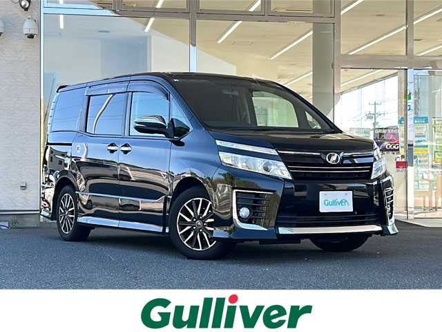 トヨタ ヴォクシー ZS 煌 福島県 2015(平27)年 14.1万km ブラック 登録時走行距離：140/528km/純正ディーラーSDナビ/（フルセグTV/CD/DVD/AM/FM）/ETC/純正マット/ステアリングスイッチ/両側パワースライドドア/アイドリングストップ/横滑り防止装置/電格ミラー/HIDヘッドライト/フォグランプ/ウィンカーミラー/PUSHスタート/ドアバイザー/純正AW/オートライト/保証書/取扱説明書