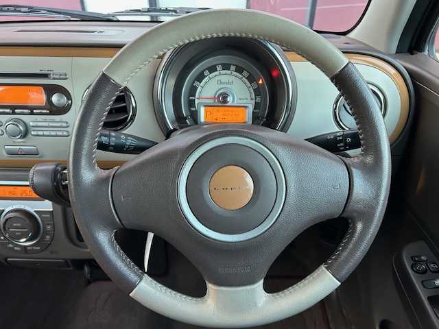 スズキ ラパン ショコラ X 宮城県 2014(平26)年 4.9万km シャンパンピンクPM 登録時走行距離４８２５２ｋｍ/プッシュスタート/アイドリングストップ/オートライト/スマートキー/ショコラ専用シート/純正フロアマット/ベンチシート/純正オーディオ/CD/AM/FM/LEDヘッドライト/ドアバイザー/純正アルミホイール/Wミラー/運転席シガーソケット/ABS/横滑り防止装置/オートライト