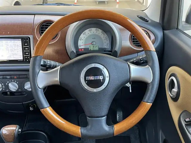 ダイハツ ミラ ジーノ プレミアムL 群馬県 2007(平19)年 3.3万km プレシャスブルーマイカメタリック ７インチＳＤナビ　/フルセグ　/Ｂｌｕｅｔｏｏｔｈ　/ＣＤ・ＤＶＤ　/ＥＴＣ　/木目調＋本革ステアリング　/木目調内装　/純正フロアマット　/電動格納ミラー　/１４インチアルミホイール　/リモコンキー　/パワーウィンドウ