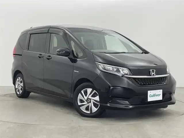 ホンダ フリード ハイブリット G ホンダセンシング 富山県 2020(令2)年 4.9万km クリスタルブラックパール 純正ナビ（AM/FM/DVD/BT/フルセグ）/バックカメラ/ETC/両側パワースライドドア/シートヒーター/衝突被害軽減システム/レーダークルーズコントロール/レーンキープアシスト/横滑り防止装置/アイドリングストップ/オートLEDライト/純正フロアマット/スマートキー/スペアキー