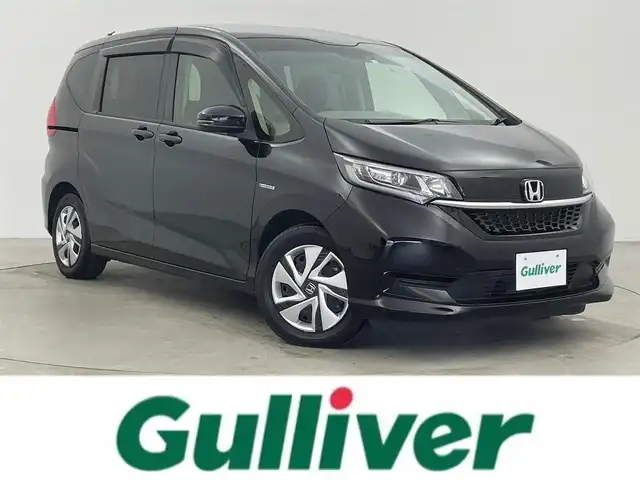 ホンダ フリード ハイブリット G ホンダセンシング 富山県 2020(令2)年 4.9万km クリスタルブラックパール 純正ナビ（AM/FM/DVD/BT/フルセグ）/バックカメラ/ETC/両側パワースライドドア/シートヒーター/衝突被害軽減システム/レーダークルーズコントロール/レーンキープアシスト/横滑り防止装置/アイドリングストップ/オートLEDライト/純正フロアマット/スマートキー/スペアキー