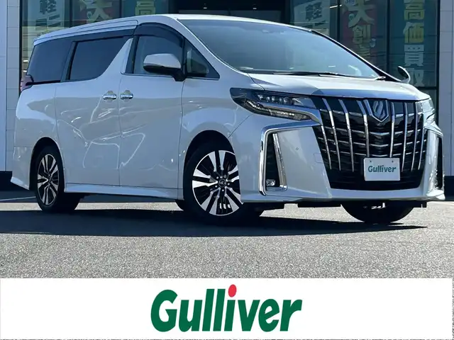トヨタ アルファード S Cパッケージ 岡山県 2018(平30)年 8.3万km ホワイトパールクリスタルシャイン 登録時走行距離82439km/ワンオーナー/純正9インチナビ/フルセグTV(AM/FM/CD/DVD/Bluetooth)/純正12.1インチフリップダウンモニター/バックカメラ/両側パワースライドドア/ビルトインETC2.0/ドライブレコーダー/パワーバックドア/トヨタセーフティセンス/・プリクラッシュセーフティ/・レーダークルーズコントロール/・オートマチックハイビーム/・レーンディバーチャーアラート/オートブレーキホールド/横滑り防止装置/D/N席シートヒーター/D/N席ベンチレーション/ステアリングヒーター/オットマン/18インチ純正AW/社外フロアマット