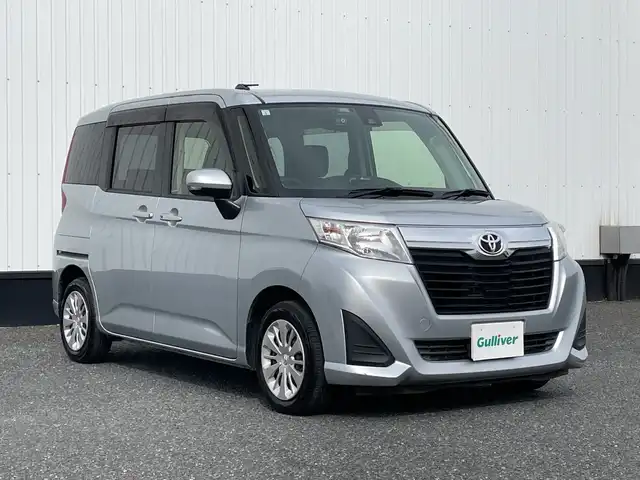 トヨタ ルーミー G－T 千葉県 2017(平29)年 1.9万km ブライトシルバーM 純正メモリナビ/(フルセグTV/BT/CD/FM/AM)/バックカメラ/衝突被害軽減システム/クルーズコントロール/両側パワースライドドア/横滑り防止装置/ビルトインETC/ドライブレコーダー/アイドリングストップ/オートライト/ウィンカーミラー/電動格納ミラー/シートリフター/プッシュスタート/スマートキー/フロアマット/ドアバイザー/スペアキー/取扱説明書/保証書