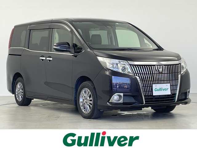 トヨタ エスクァイア Gi 岐阜県 2017(平29)年 4.3万km スパークリングブラックパールクリスタルシャイン 純正フリップダウンモニター/純正9インチSDナビ（NSZT-Y66T)/フルセグ/BT/DVD/USB/HDMI/バックカメラ/ビルトインETC/トヨタセーフティセンスC/・プリクラッシュセーフティシステム/・レーンディパーチャーアラート/・オートマチックハイビーム/クルーズコントロール/アイドリングストップ/合皮シート/前席シートヒーター/両側パワースライドドア/ウッドコンビハンドル/純正15インチAW/サイドバイザー/プッシュスタート/LEDオートライト/フォグランプ/MTモード付AT