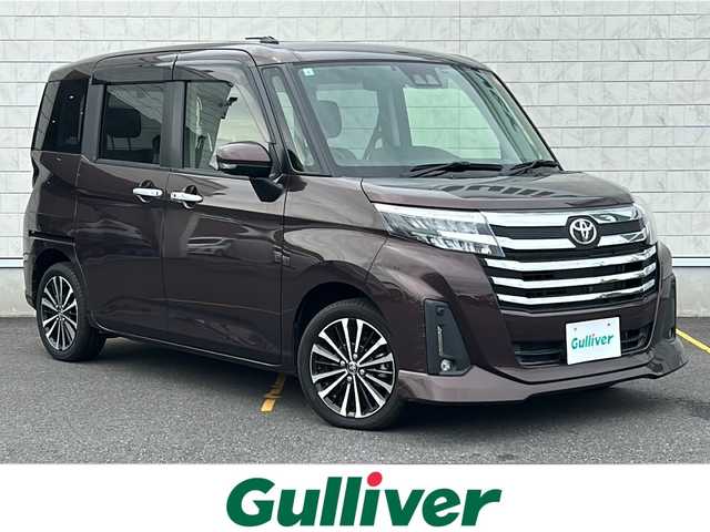 トヨタ ルーミー カスタムG－T 茨城県 2021(令3)年 2.1万km プラムブラウンパールクリスタルシャイン 純正ディスプレイオーディオ/バックカメラ/パノラミックビューモニター/両側パワースライドドア/スマートアシスト/衝突回避支援ブレーキ/衝突警報機能/アダブティブクルーズコントロール/レーンキープアシスト/純正15インチAW/LEDオートライト/オートマチックハイビーム/社外フロアマット/ビルトインETC/ステアリングリモコン/前後ドライブレコーダー/スマートキー/プッシュスタート/取扱説明書
