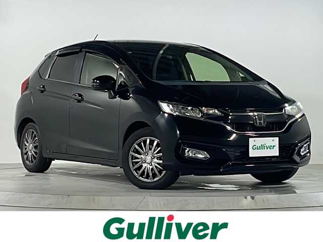 ホンダ フィット 13G L ホンダセンシング 広島県 2018(平30)年 6.8万km クリスタルブラックパール 禁煙/ホンダセンシング/●衝突軽減ブレーキ〈CMBS〉/●誤発進抑制機能/●歩行者事故低減ステアリング/●路外逸脱抑制機能/●ACC〈アダプティブ・クルーズ・コントロール〉/●LKAS〈車線維持支援システム〉/●先行車発進お知らせ機能/●標識認識機能/社外ナビ（CN-RE04D）/・フルセグ/CD/DVD/Bluetooth/SD/バックカメラ/ステアリングスイッチ/オートライト/Fパッケージ/・IRカット/UVカットガラス/・LEDドアウィンカーミラー/・オートリトラミラー/Lパッケージ/・LEDヘッドライト〈インラインタイプ〉/・LEDフォグライト/・前席用i-サイドエアバッグ＋サイドカーテンエアバッグ/セキュリティアラーム/オートエアコン/前後ドライブレコーダー（ユピテル）/ETC/社外15インチアルミホイール