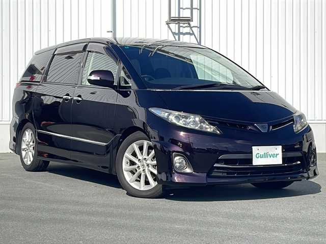 トヨタ エスティマ アエラス 20thアニバーサリー 三重県 2012(平24)年 9.6万km ボルドーマイカメタリック 禁煙/純正ナビ/サンルーフ/純正後席モニター/バックカメラ/ETC/コーナーセンサー/ハーフレザーシート/両側パワースライドドア/クルーズコントロール/オットマン/ウッドコンピステア/ステアスイッチ/LEDオートライト/電動格納ミラー